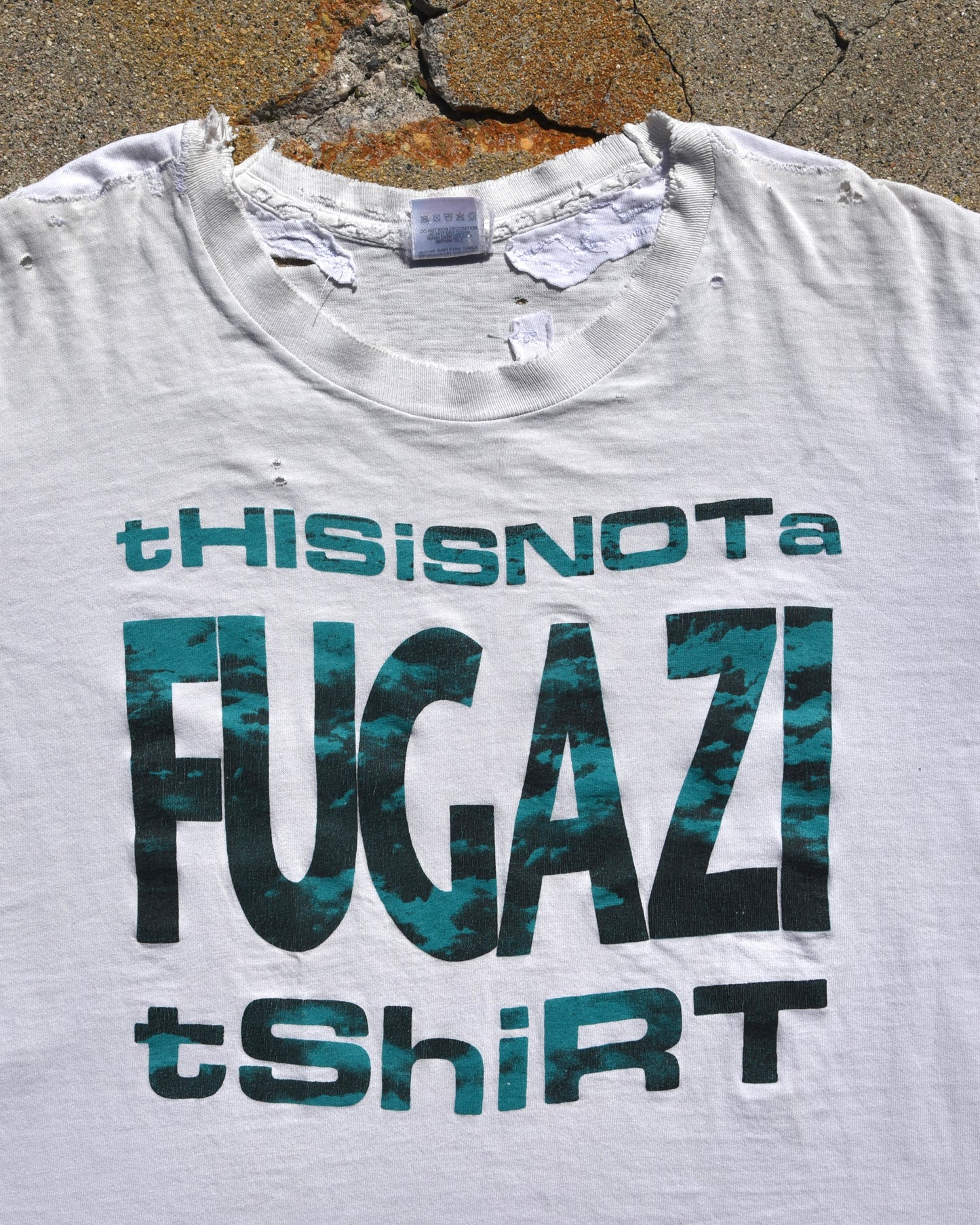 1990s Thrashed and Repaired This Is Not A Fugazi Tshirt