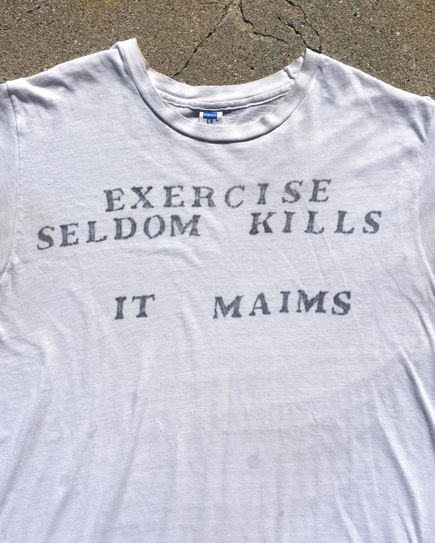 1970s Exercise Seldom Kills It Maims Tshirt